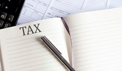 Notebook with Toolls and Notes about TAX
