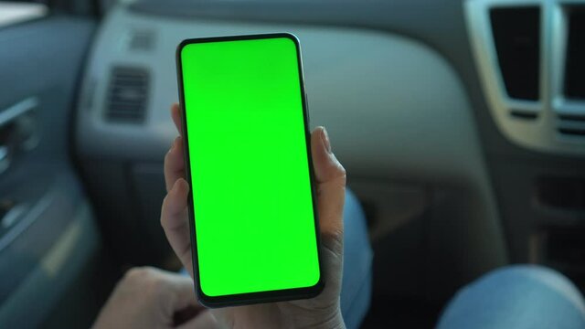 Close Up Of A Woman's Hand Holding A Mobile Telephone With A Vertical Green Screen In Car Chroma Key Smartphone Technology Cell Phone Street Touch Message Display Hand