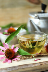 Echinacea tea cup. Echinacea flowers and leaves. Brewing tea with echinacea.