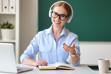 Smart teacher talking to camera.