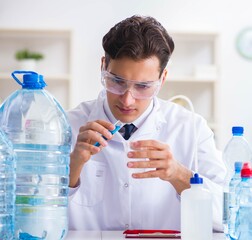 Lab assistant testing water quality