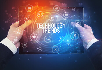 Close-up of a tablet with TECHNOLOGY TRENDS inscription, innovative technology concept