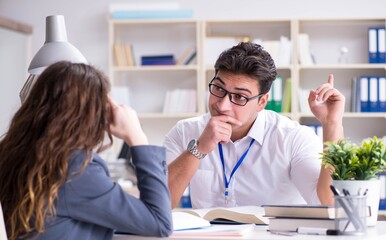 Sales assistant discussing transaction with customer