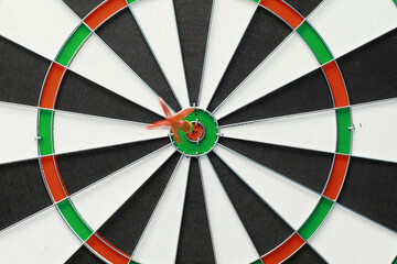 Darts. The dart for playing in the game board is stuck. Hit the sector in darts. The concept of a successful strategy.