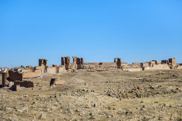 Panoramic view onto ruins of medieval ghost city Ani, near Kars, Turkey. There are ruins of walls, towers, gates & archs. City was founded in 5 century. Now it's included in UNESCO List