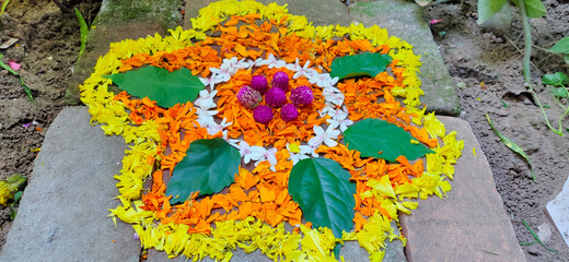 onam festival flower mat made using flowers and leaves