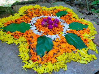 onam festival flower mat made using flowers and leaves