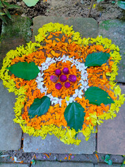 onam festival flower mat made using flowers and leaves