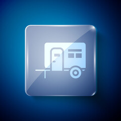 White Rv Camping trailer icon isolated on blue background. Travel mobile home, caravan, home camper for travel. Square glass panels. Vector.