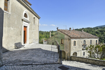 Obraz premium A narrow street among the old houses of Sepino, a medieval village in the Molise region.