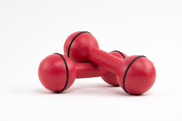 Red dumbbells on a white background