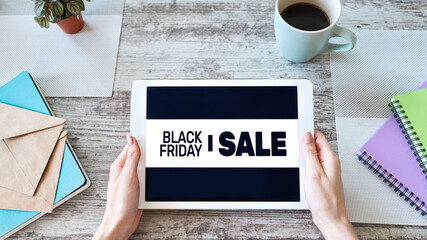 Black friday sales banner on device screen. E-commerce, internet business and digital marketing.