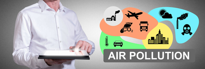 Air pollution concept with man using a tablet