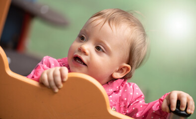 Cute baby playing on a playground