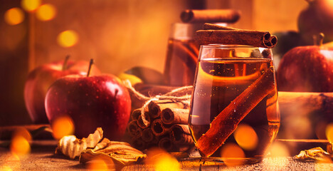 Hard Apple Cider Ale Ready to Drink. Cocktail with cinnamon, vintage wooden background
