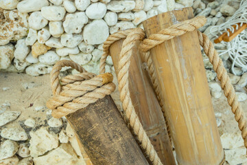 Bamboo trunks with ropes for a beach fence