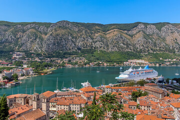 Naklejka na ściany i meble A cruise ship moored at the harbour in the old town in Kotor, Montenegro