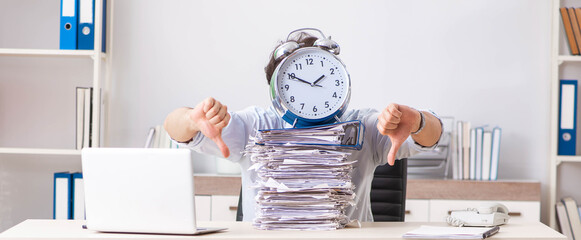 Overloaded busy employee with too much work and paperwork