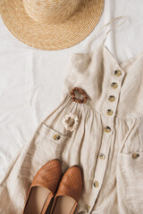 Beauty fashion collage with women's clothes and accessory on white linen. Sun dress sarafan,...