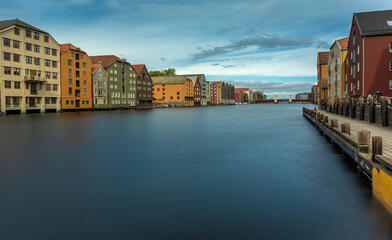 The colorful and iconic old city wharves along the Nidelva river in Trondheim, Trondelag, Norway. Symbol of the historical role of Trondheim as a merchant city.