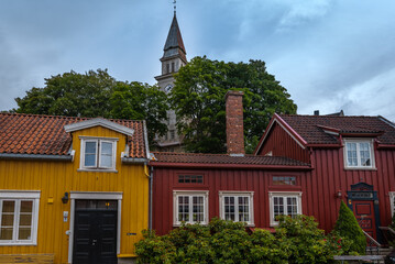 The colorful back streets of the old city wharves district along the Nidelva river in Trondheim, Trondelag, Norway. Symbol of the historical role of Trondheim as a merchant city.