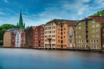 The colorful and iconic old city wharves along the Nidelva river in Trondheim, Trondelag, Norway. Symbol of the historical role of Trondheim as a merchant city.