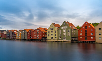 The colorful and iconic old city wharves along the Nidelva river in Trondheim, Trondelag, Norway. Symbol of the historical role of Trondheim as a merchant city.