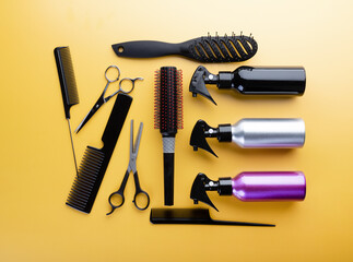Hairdresser set with different tools on yellow background. Professional equipment for haircut