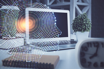 Double exposure of work space with computer and human brain drawing hologram. Brainstorm concept.