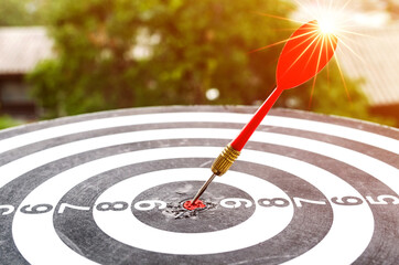 Bullseye is a target of business concept. business marketing as concept.Dartboard is the target and...