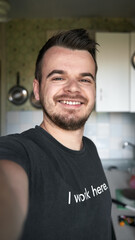 bearded caucasian man smiling selfie indoors