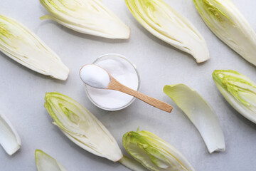 Green chicory with inulin powder. Healthy food concept.