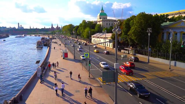 Moscow / Russia - 17 Aug 2020:  Video of panorama of the city of Moscow, a view of the moving traffic flow and the river on a Sunny summer day