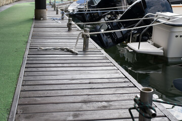 Close-up of a rope tied around the pier, moored ship