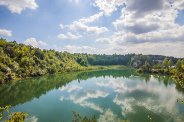 A picturesque lake located in a former basalt quarry. Pure water and wonderful nature. Basalt...