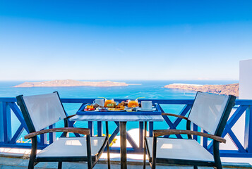 Fototapeta premium Breakfast with a view of the Caldera in Santorini, Greece