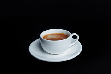 cup with drink on black background