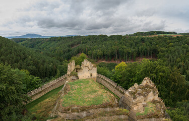Fototapeta na wymiar view from the tower of castle Helfenburk u Usteka on the castle ruins and the surrounding hills