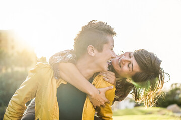 Happy gay couple having tender moments walking outdoor - Young women having a date - Equality...
