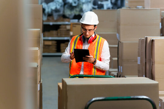 Employee of a logistics warehouse conducts an inventory of products