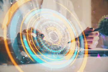 Tech theme hologram over woman's hands taking notes background. Concept of hightech. Double exposure