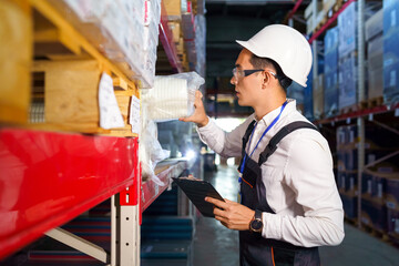 Warehouse worker takes the desired product from the shelf
