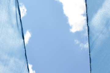 Blue cloth over cloudy sky