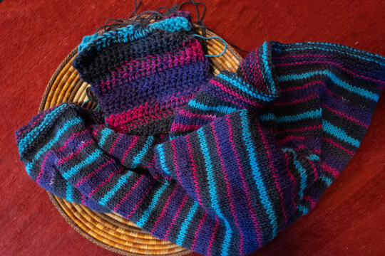 hand knit squares, scarves, and hats 