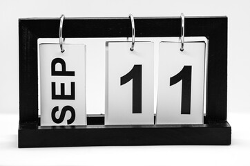 Desktop calendar with the date of September 11 on a white background. Day of Remembrance, Patriot...