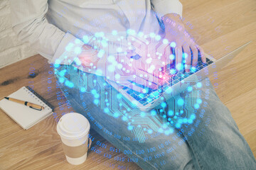 Businessman with computer background with brain theme hologram. Concept of brainstorm. Multi exposure.