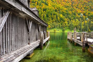 Fototapeta na wymiar wooden pier on Königssee lake in autumn in Berchtesgaden in Bavaria in Germany