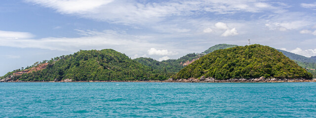 There are many beautiful islands in the Gulf of Thailand. Many of them are, like this one, hilly...