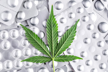 Marijuana leaf and medical pills.Legalizing marijuana for medical purposes.Hemp buds - medical...
