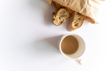 top view of Baguette bread slices and coffee cup